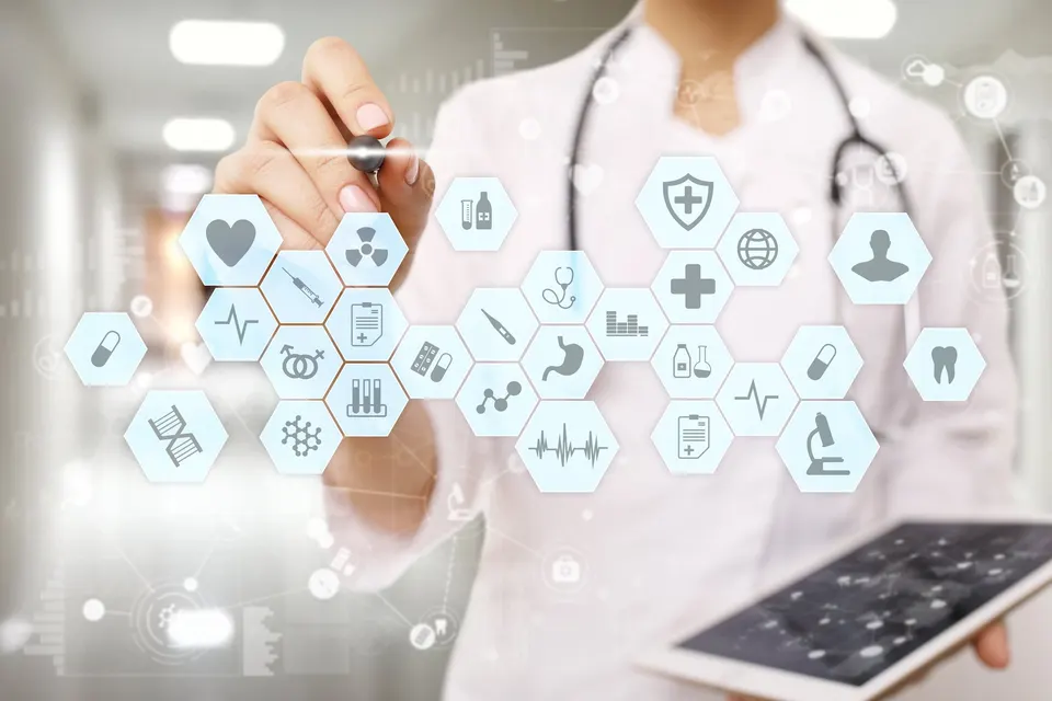 A doctor in a white coat with a stethoscope holds a tablet, overlaid with glowing medical icons.